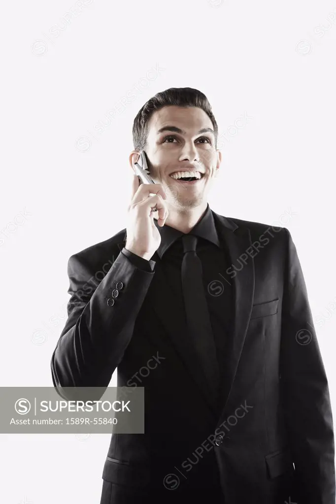 Middle Eastern businessman talking on cell phone