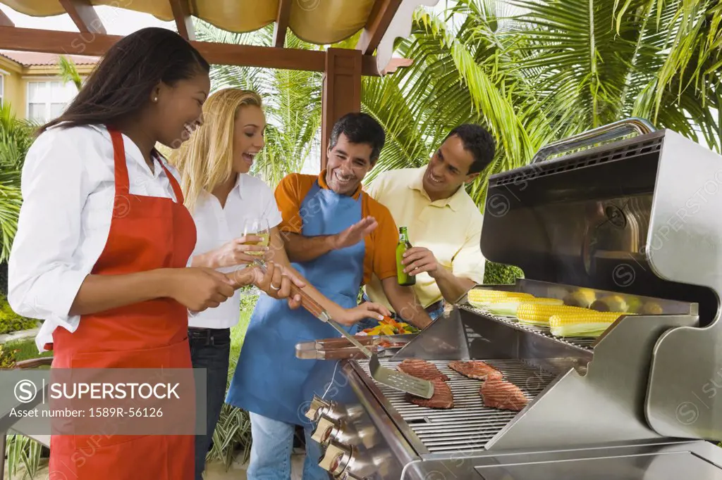 Multi-ethnic friends barbecuing