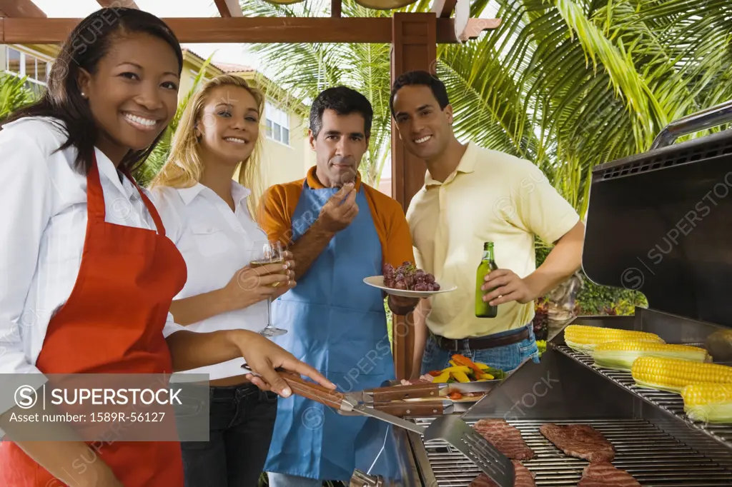 Multi-ethnic friends barbecuing