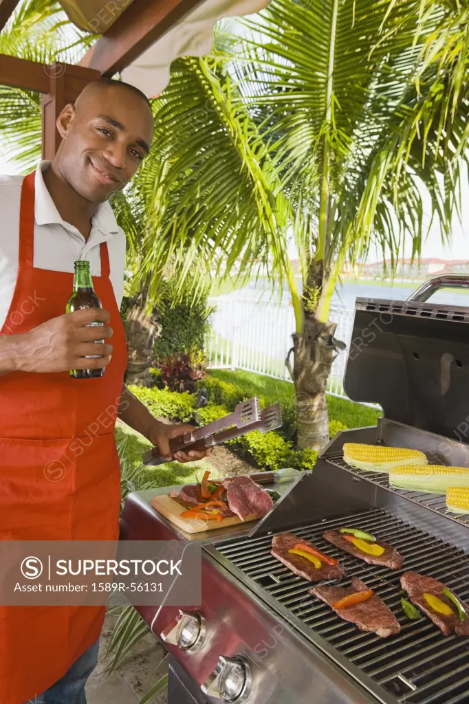African man barbecuing