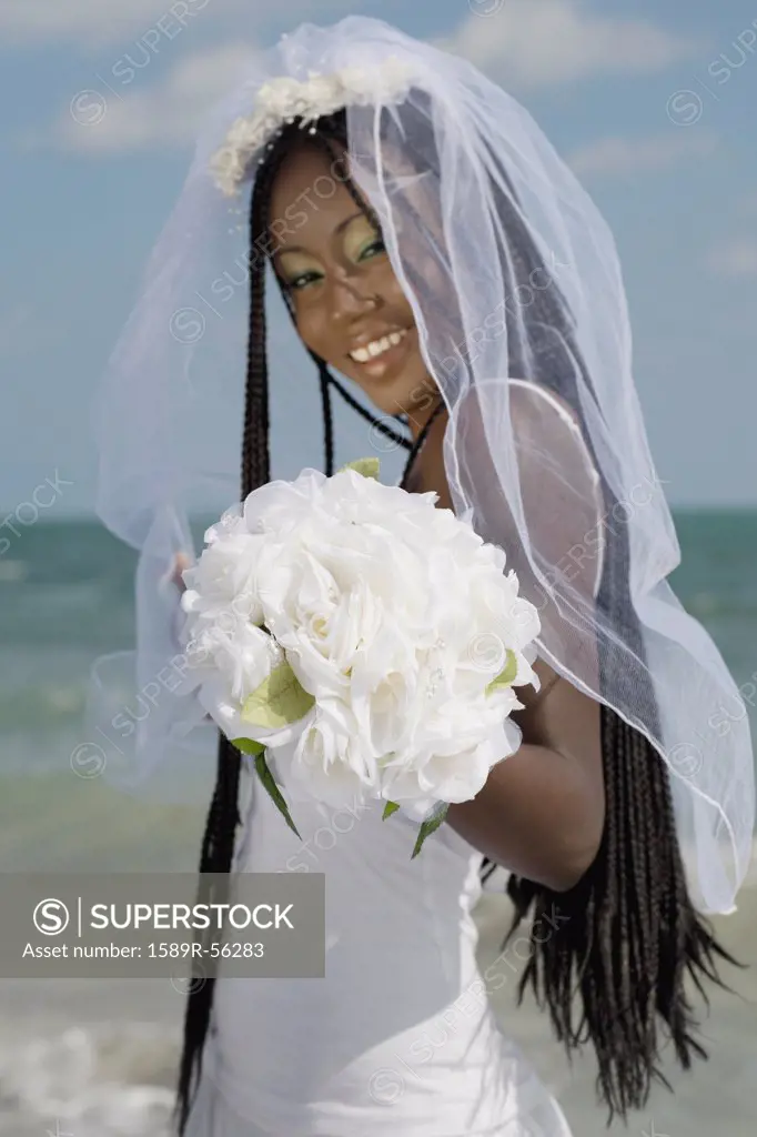African bride holding bouquet