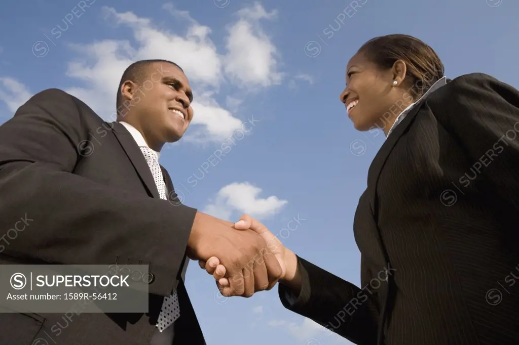 African businesspeople shaking hands