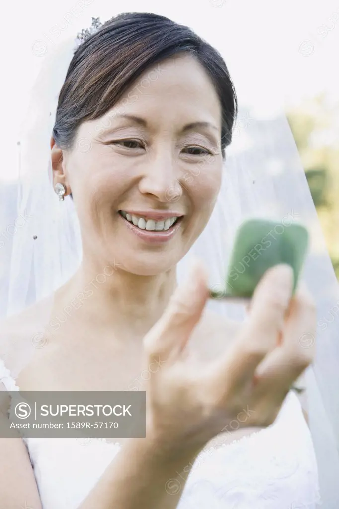 Asian bride looking in mirror