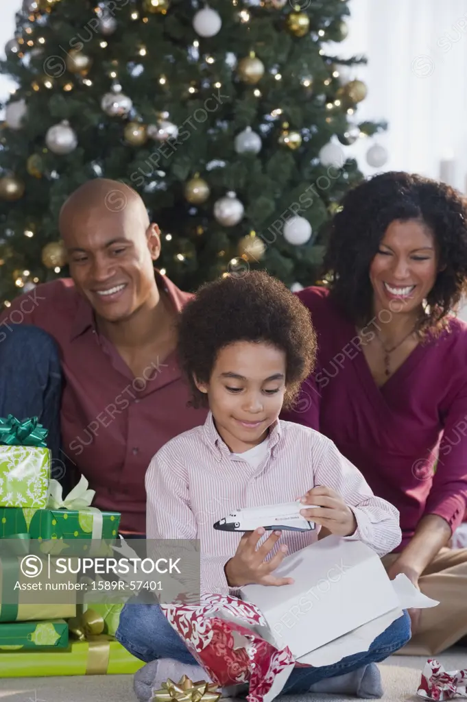 African family opening Christmas gifts