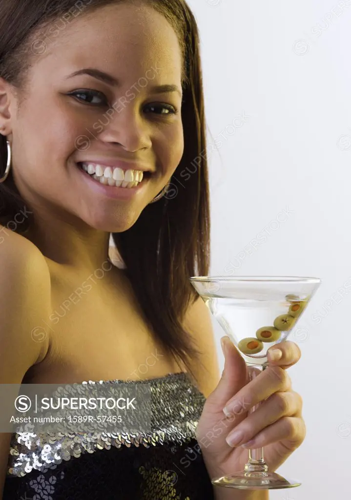 African woman drinking martini