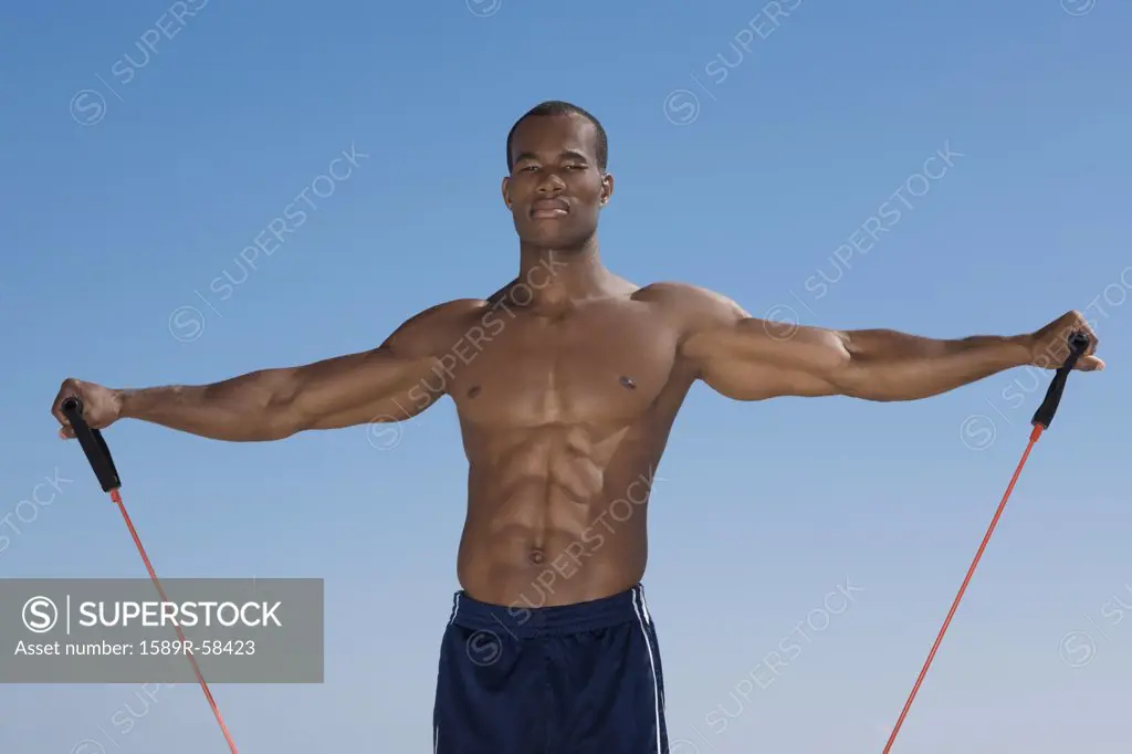 African man stretching with exercise band