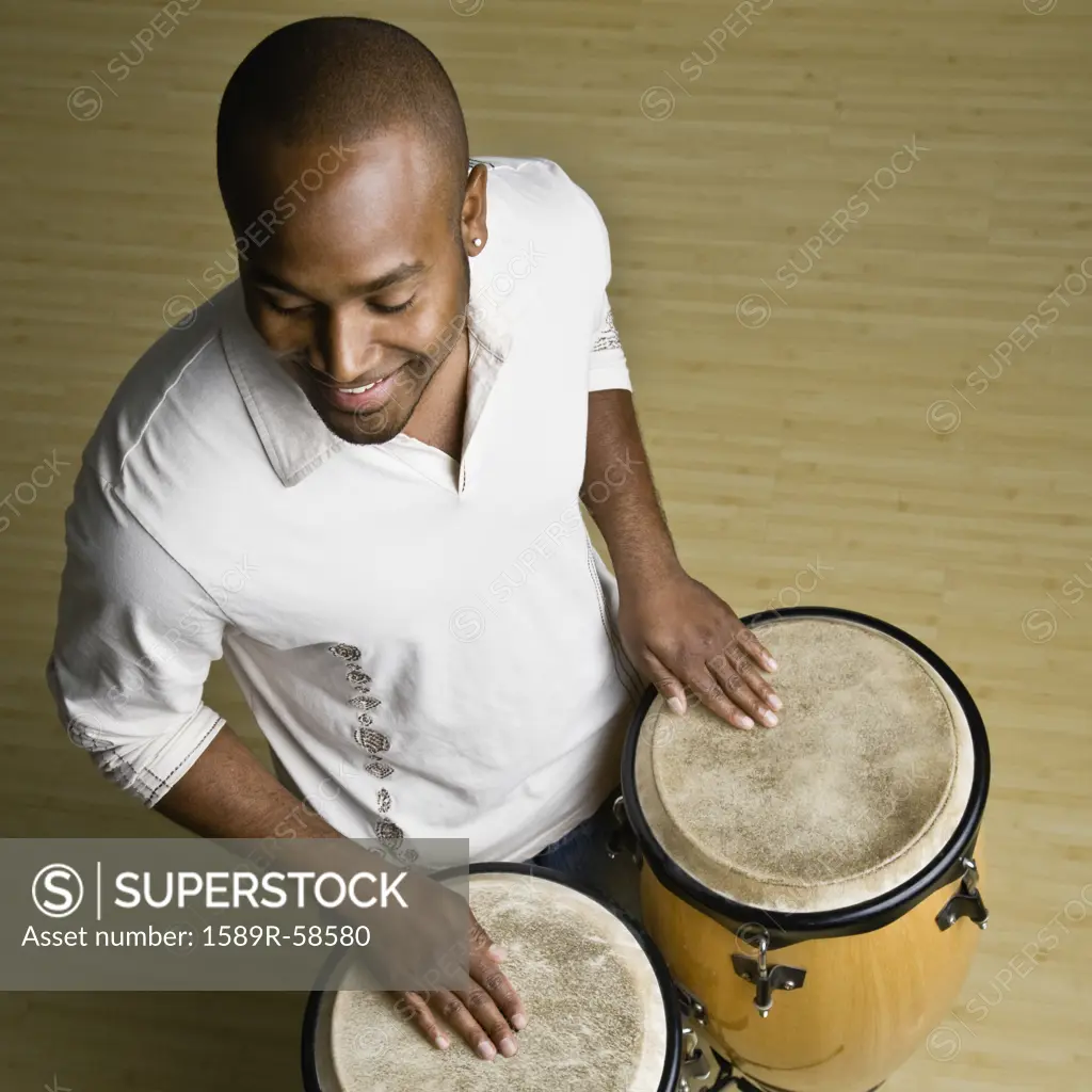 African man playing bongos