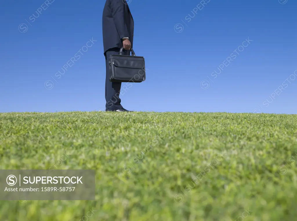 African businessman holding briefcase