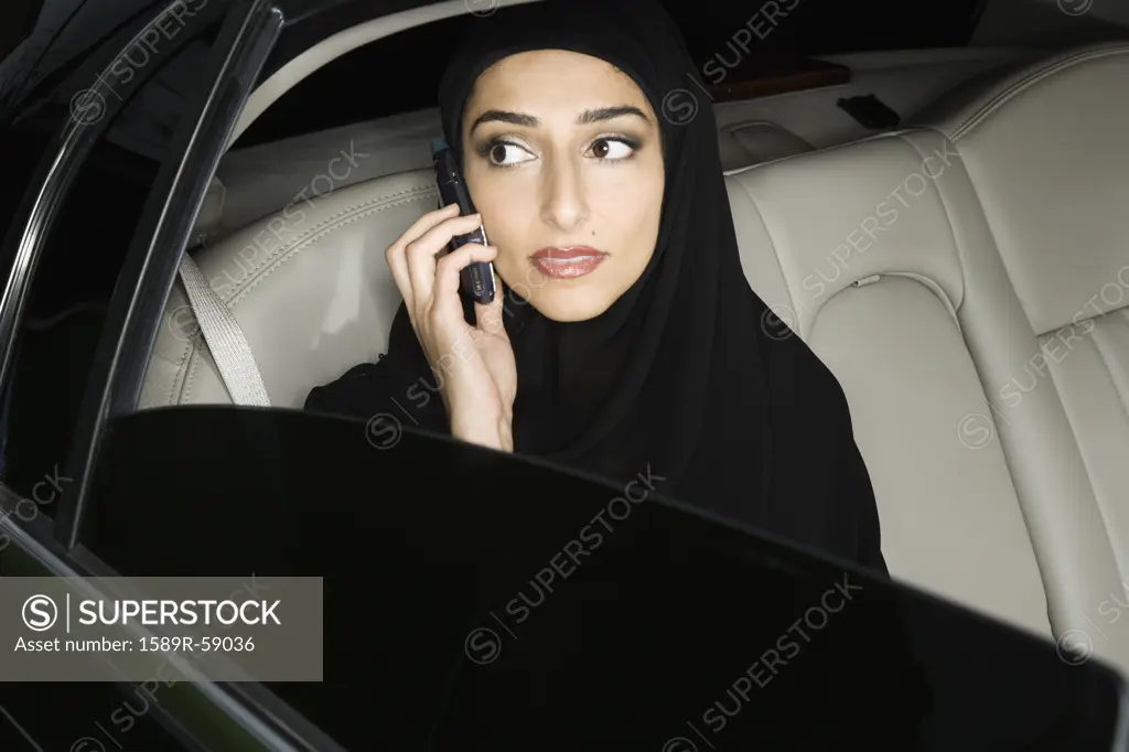 Middle Eastern businesswoman talking on cell phone