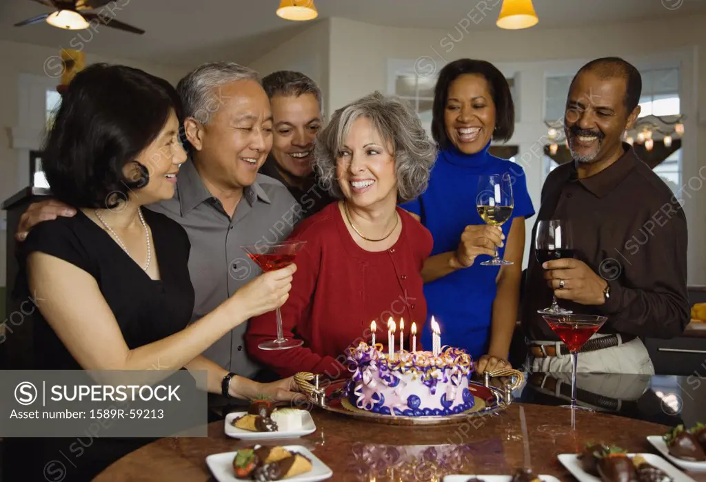 Woman celebrating birthday with multi-ethnic friends