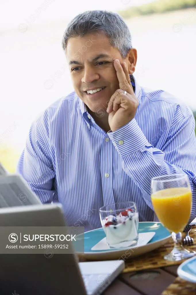 Hispanic man at breakfast table
