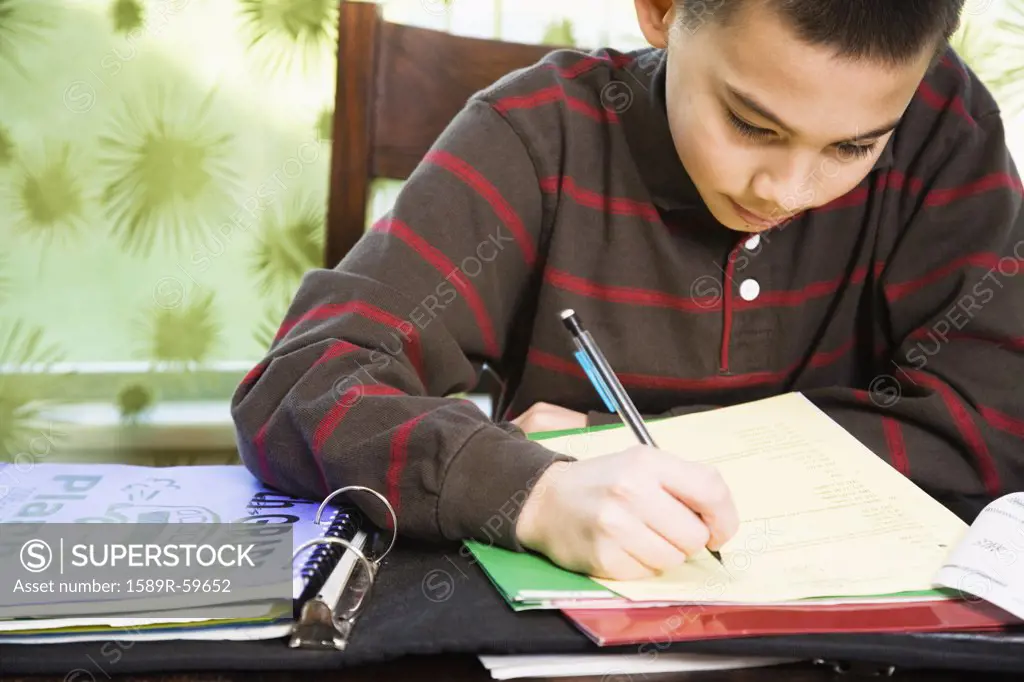 Asian boy doing homework
