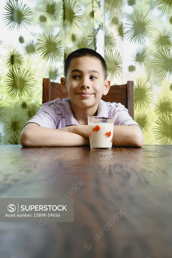 Asian boy with glass of milk