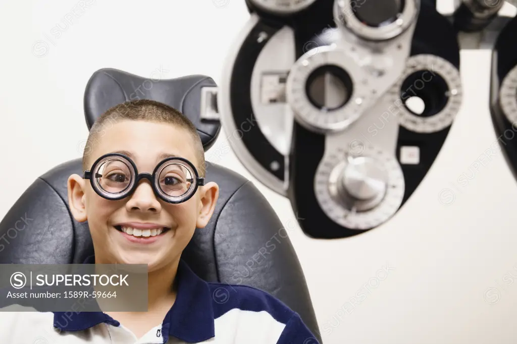 Asian boy in eye doctors office