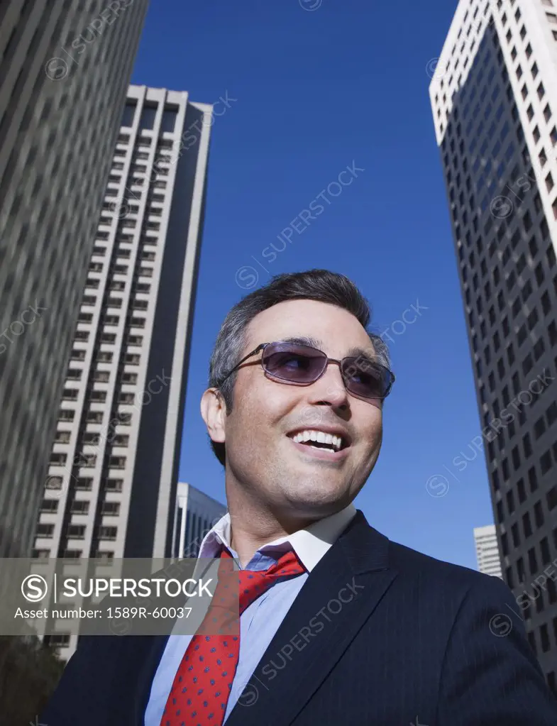 Hispanic businessman wearing sunglasses
