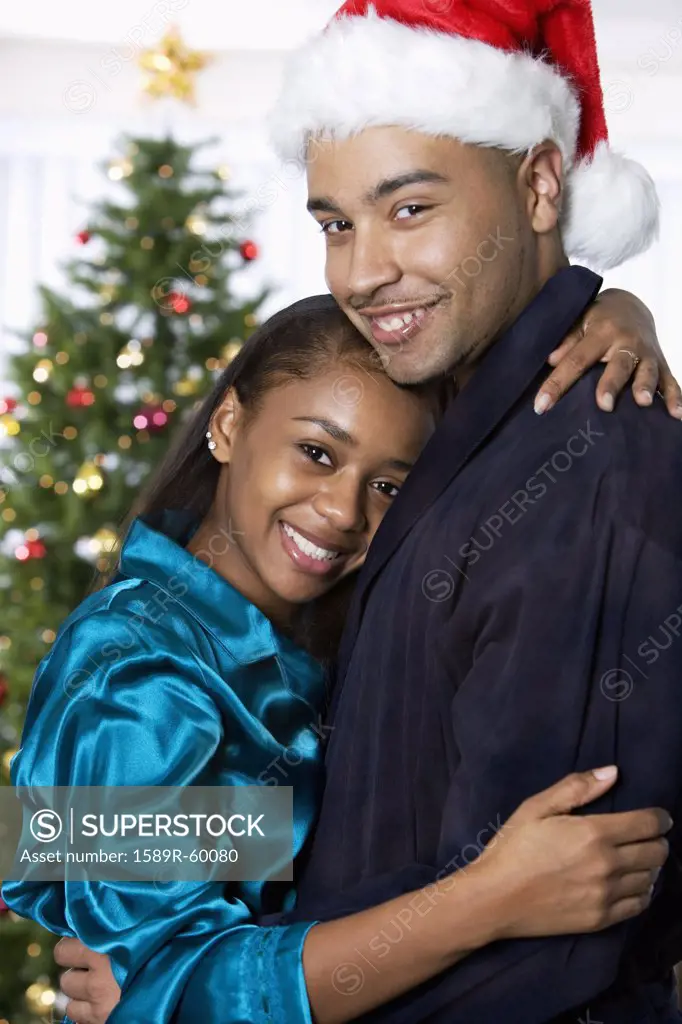 African couple hugging