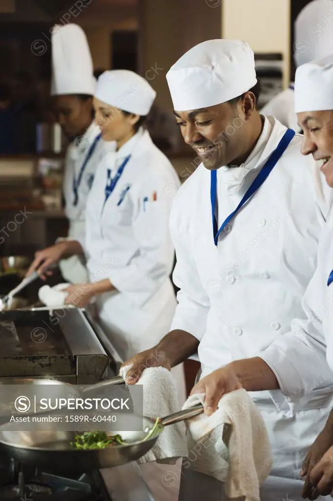 Multi-ethnic chefs preparing food
