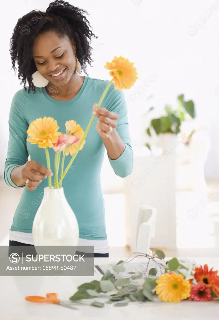 African woman arranging flowers