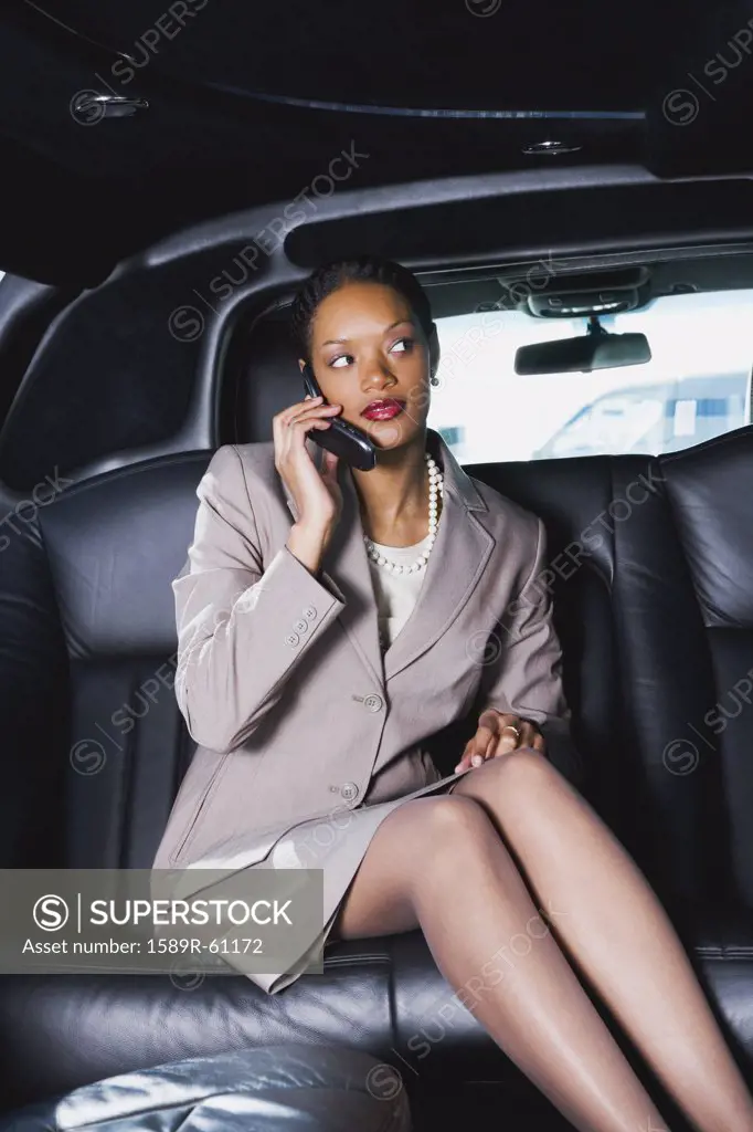 African businesswoman talking on cell phone