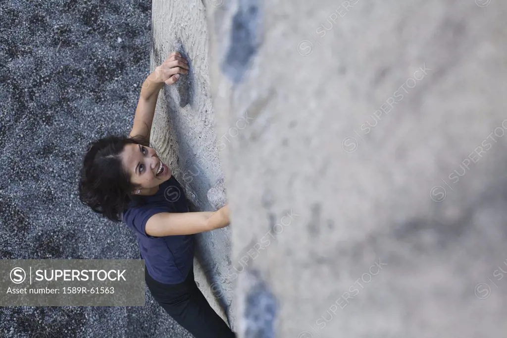 Filipino woman rock climbing