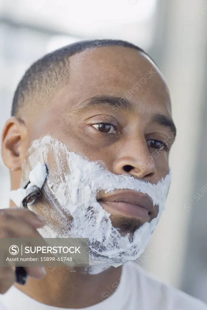 African man shaving