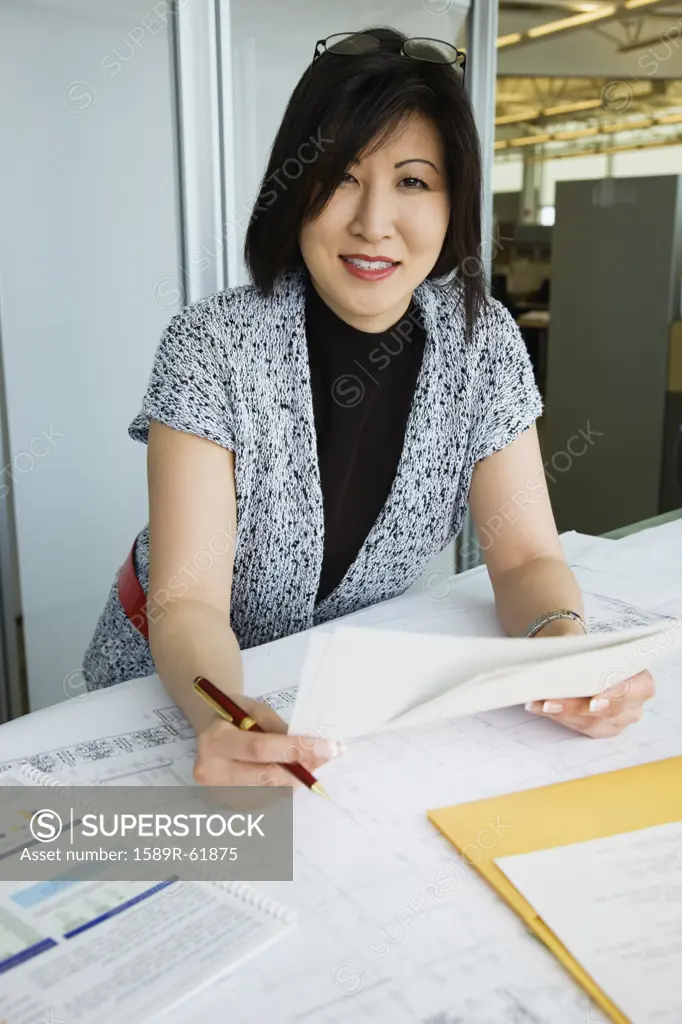 Asian American businesswoman working in office