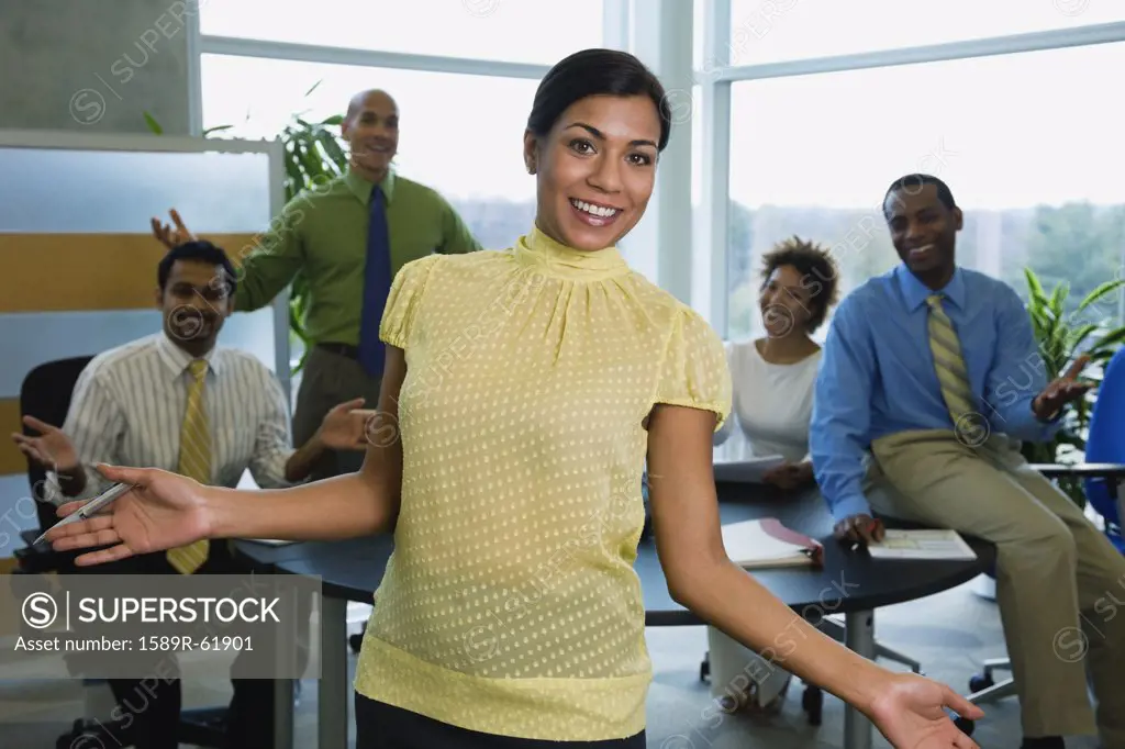Multi-ethnic business people gesturing in office