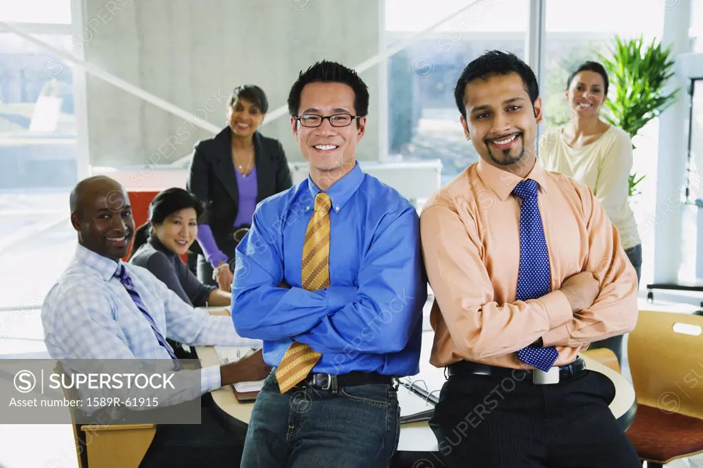 Multi-ethnic business people posing in office