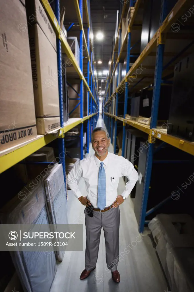 African manager working in warehouse