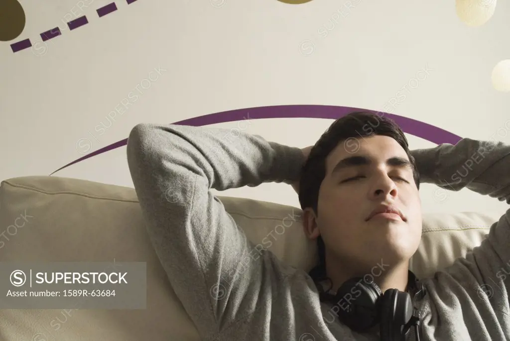 Hispanic man with headphones relaxing