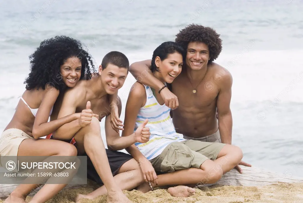 Multi-ethnic friends relaxing at beach