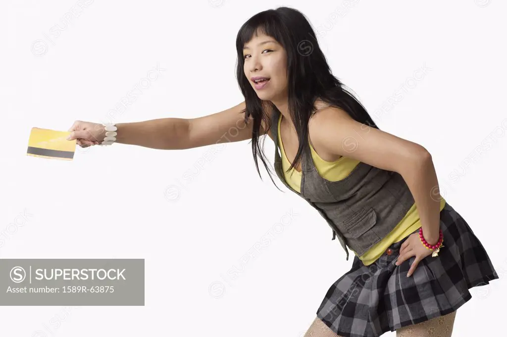 Asian woman holding credit card
