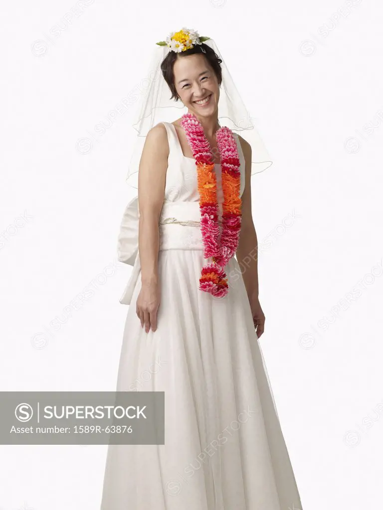 Asian woman in wedding dress and lei