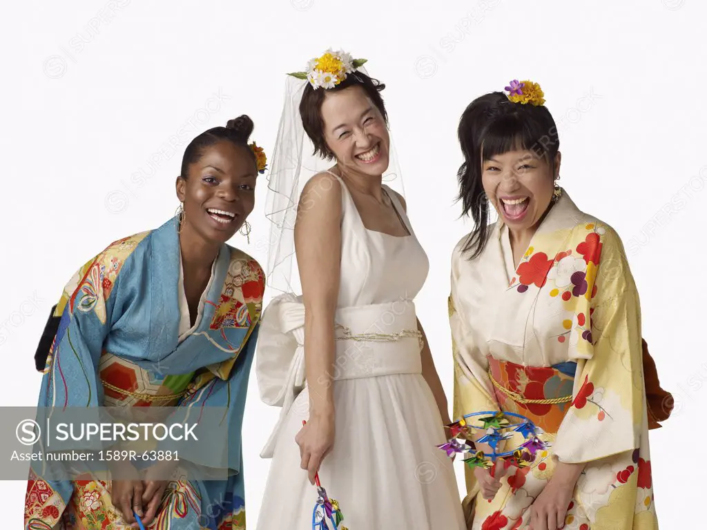 Asian bride with bridesmaids in traditional clothing