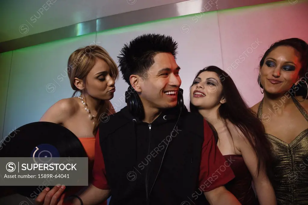 Women flirting with DJ in nightclub