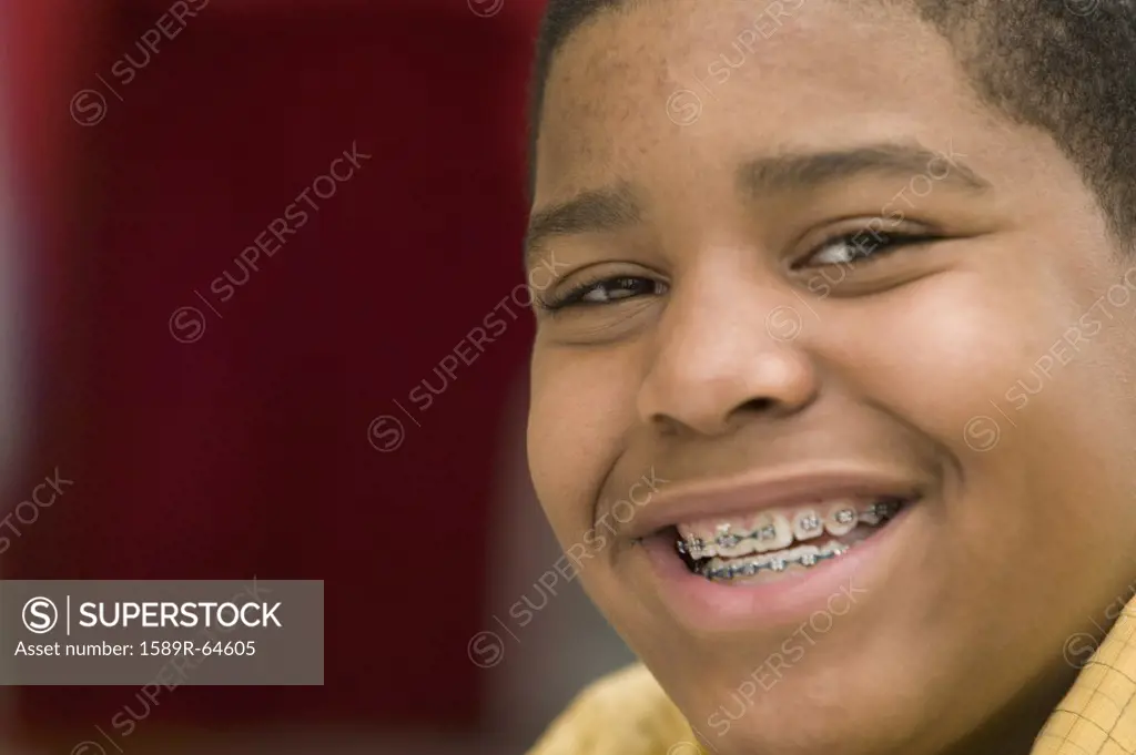 Portrait of African boy with braces