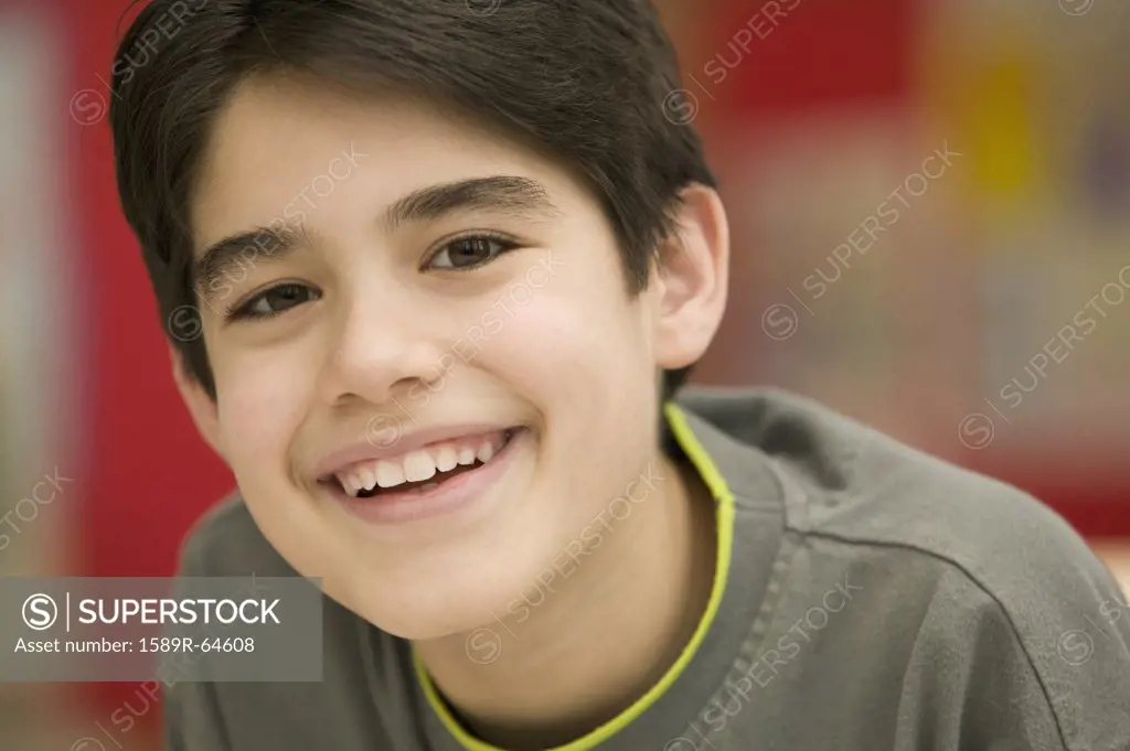 Portrait of Hispanic boy smiling