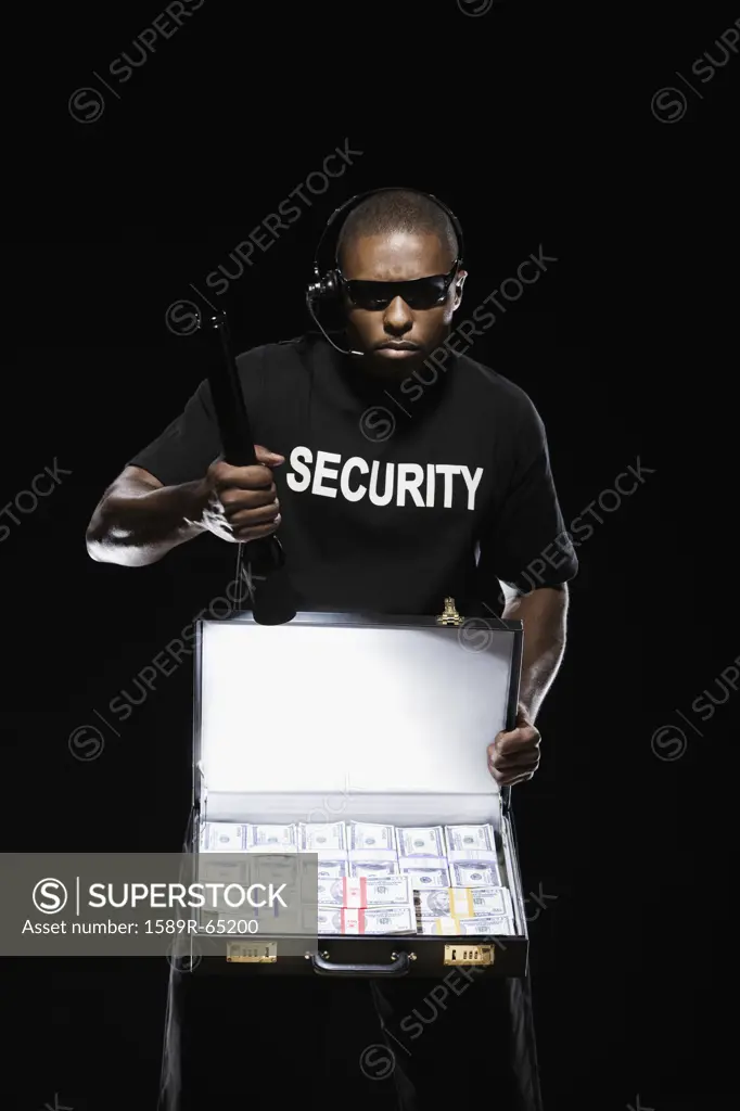 African security guard with briefcase full of money