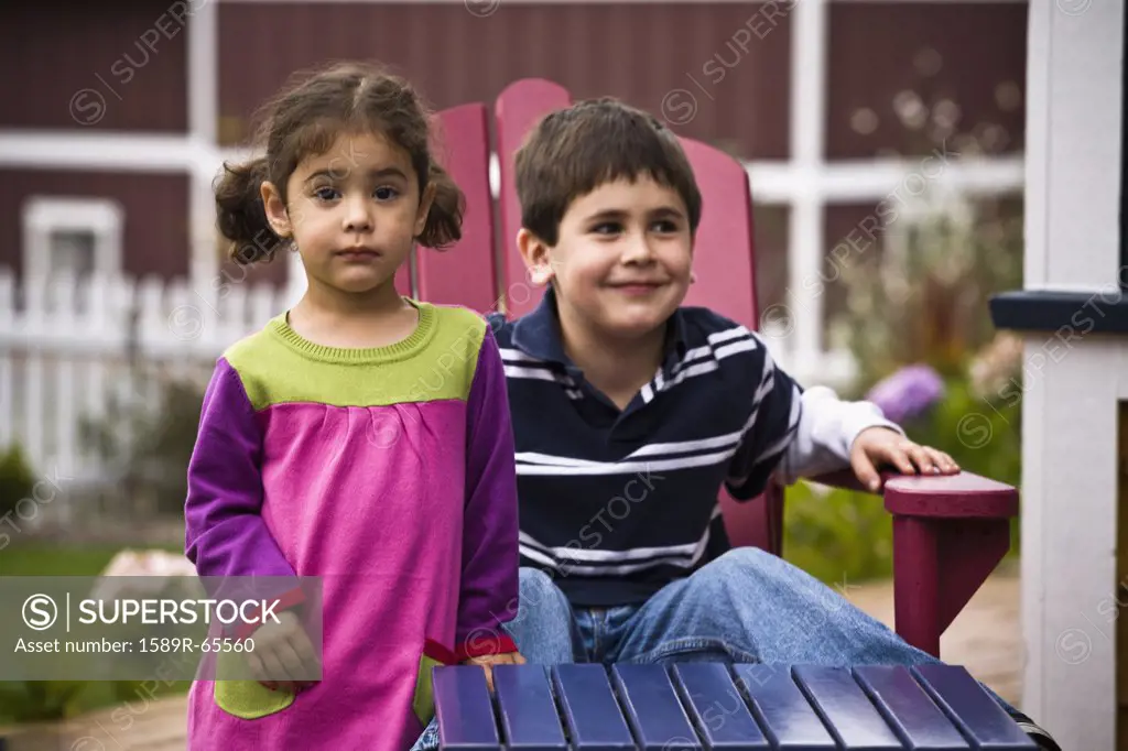 Brother and sister in backyard