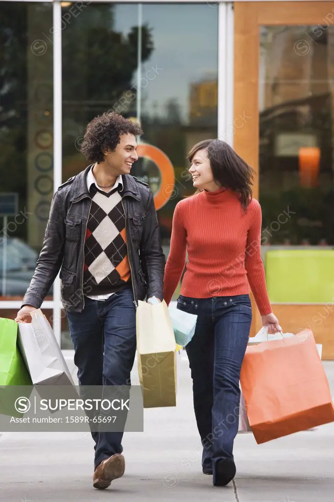 Couple carrying shopping bags