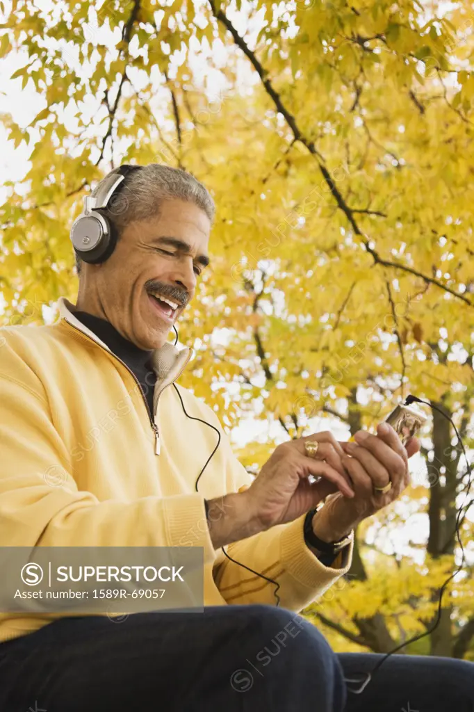 African man listening to mp3 player