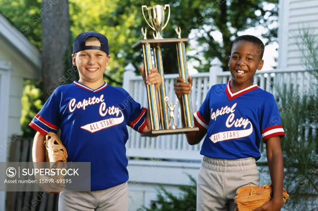 Two boys with baseball trophy