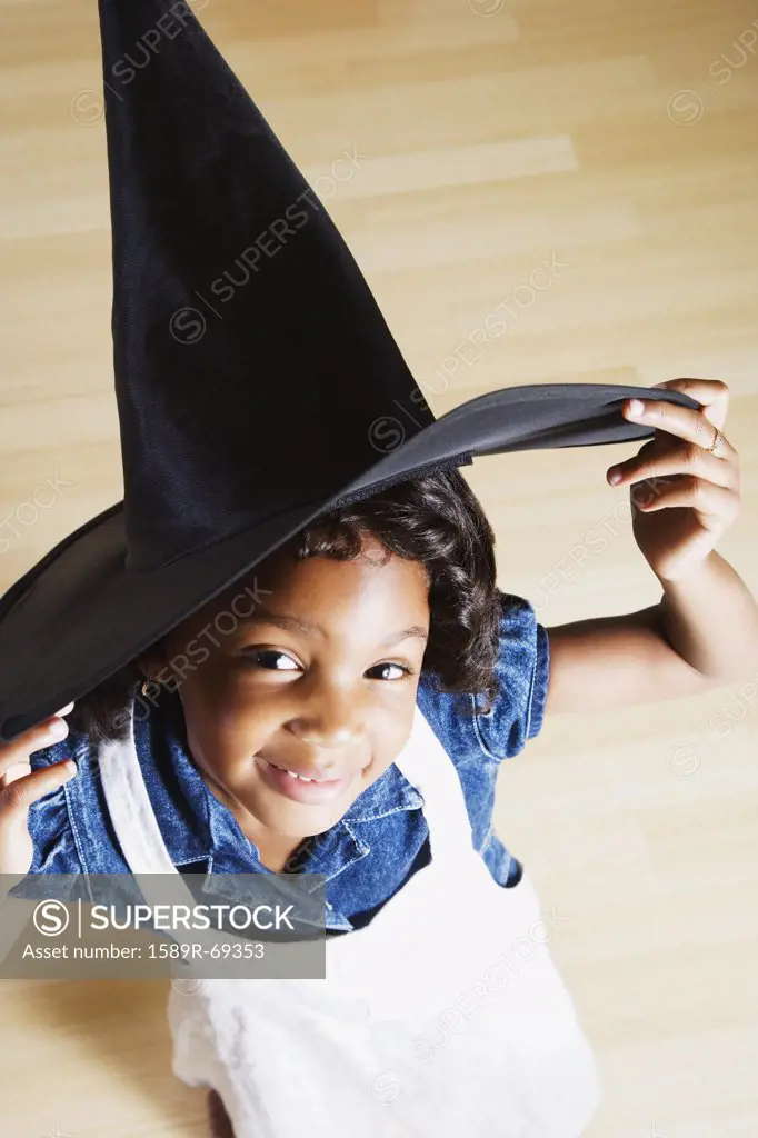 African girl wearing witch hat