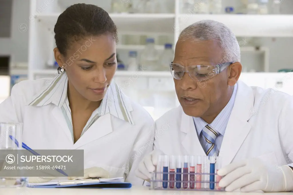 African scientists performing analysis in laboratory