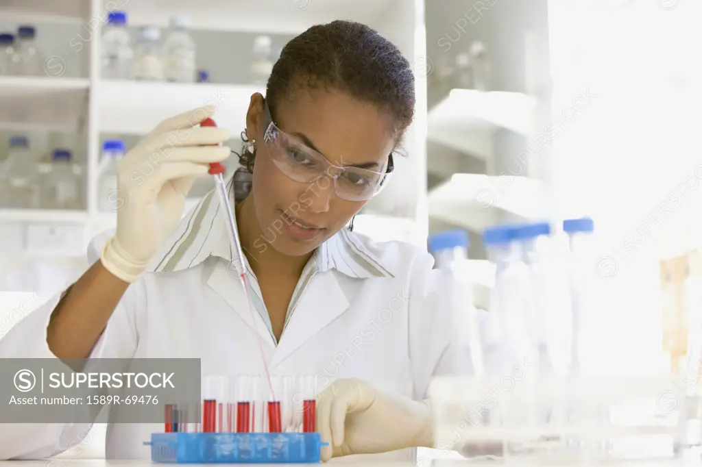 African scientist performing analysis in laboratory