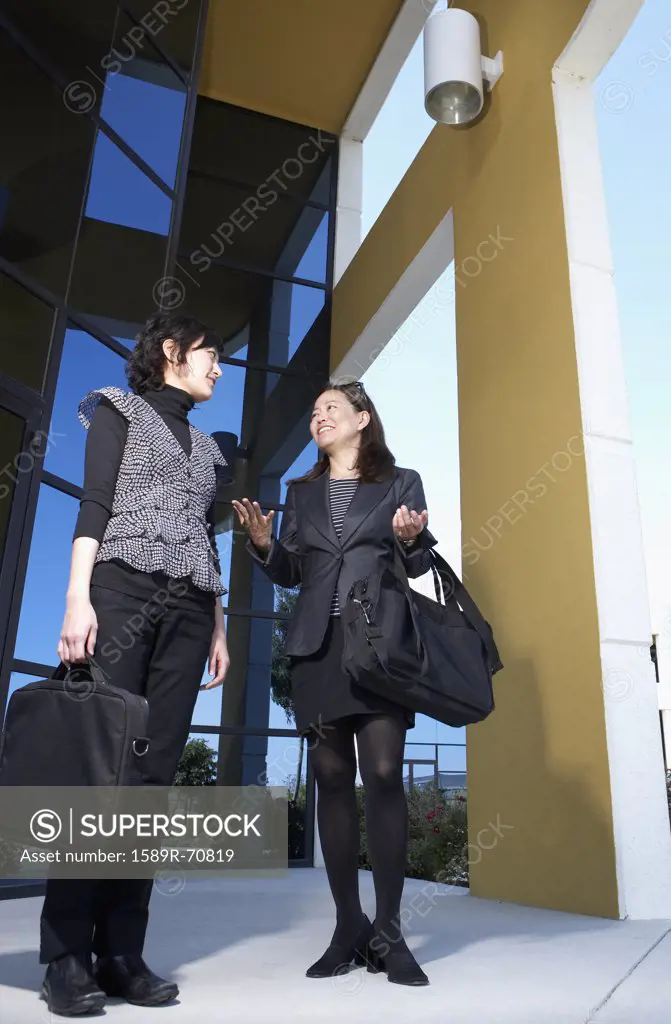 Low angle view of Asian businesswomen talking