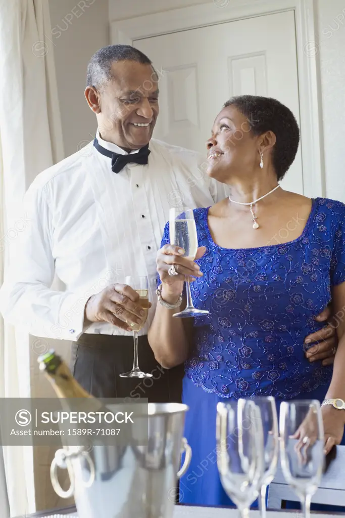 African couple drinking champagne 