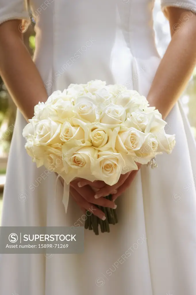 Bride holding flower bouquet