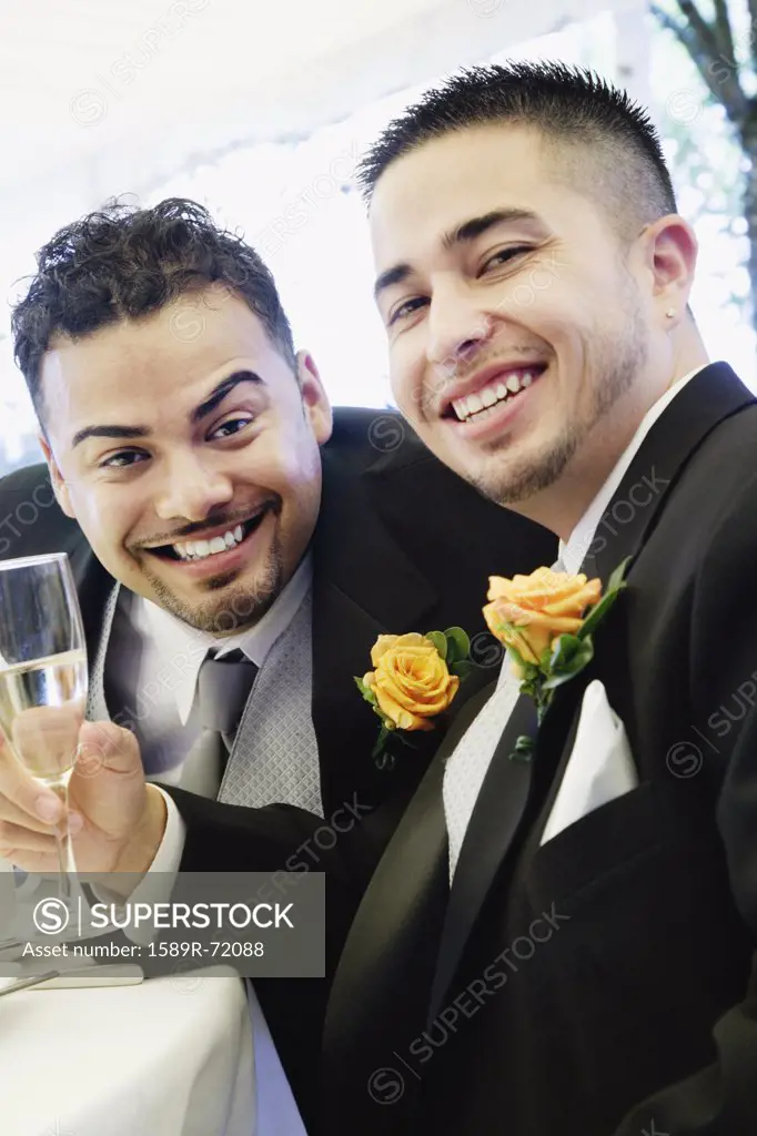 Multi-ethnic men wearing tuxedos