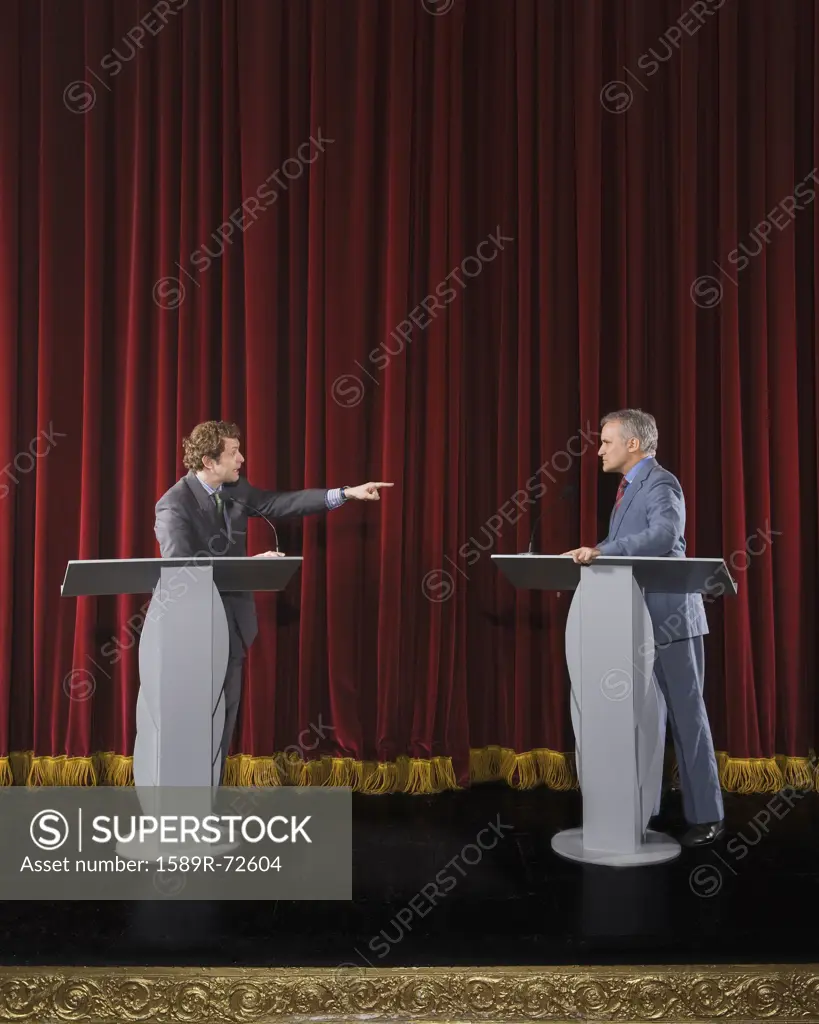 Politicians having debate on stage